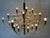 Original Gino Sarfatti for FLOS chandelier. Gold-colored version. Labeled. Original ceiling rose. Very nice condition....
