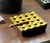A striking large-format cigar ashtray combining a deep black base with a sculptural brass-tone gold upper section. The...
