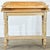 This 19th-century English vanity table is painted with a unique faux bois finish to imitate different kinds of maple. The...