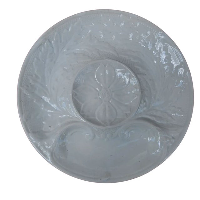 Stunning French Gien white majolica artichoke plates, circa 1960s.. Signed on the reverse. The plates have a lovely center...