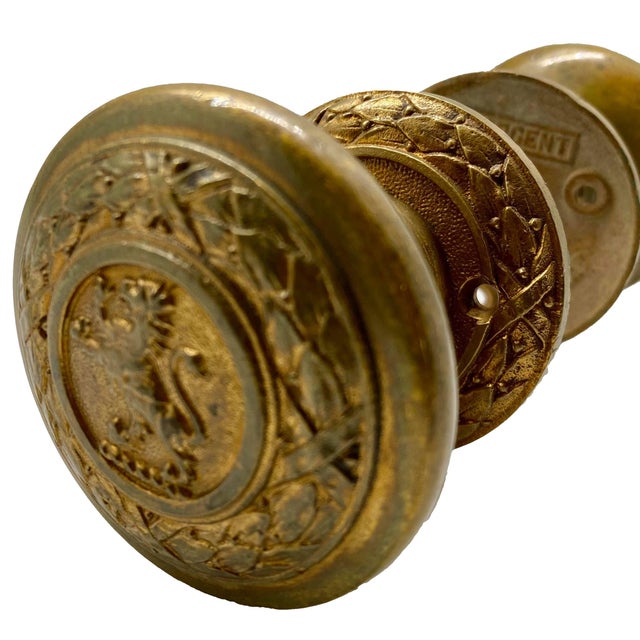 Original Pair of the Standing Lion with a circular wreath design manufactured by Sargent, circa 1920. The door rosettes...