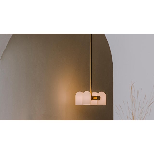 Influenced by the fashions of the future, in large and small scale. A quadratic structure of four glass shades suggests...