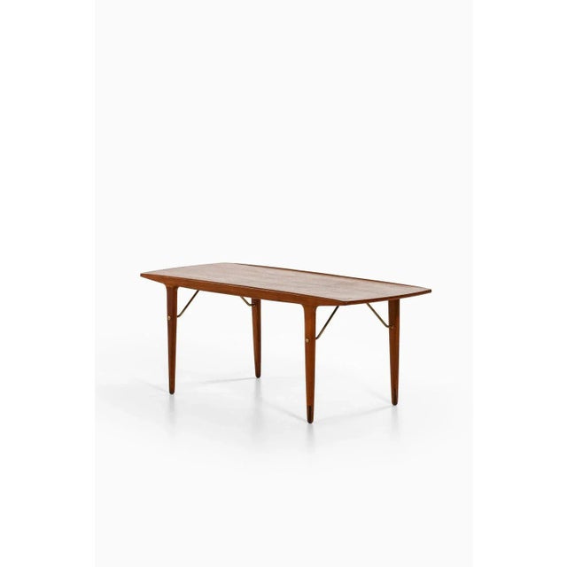 Rare and early coffee table in teak and brass by johannes andersen, 1950's additional information: material: teak and...