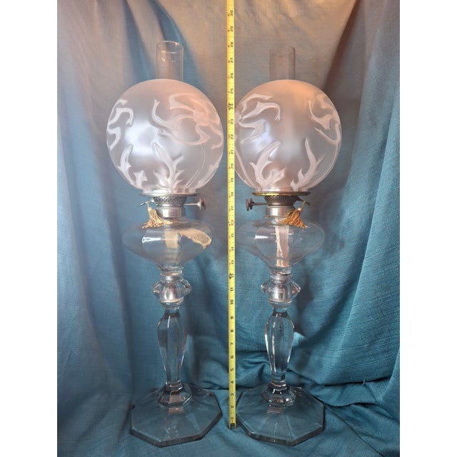 This offering features a rare, matched pair of Fostoria Glass Co. No. 17 Kerosene Banquet Lamps, dating to the first...