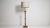 Turned walnut floor lamp in Rich Walnut Brown. The rich walnut brown surface highlights slender turned column, linen drum...
