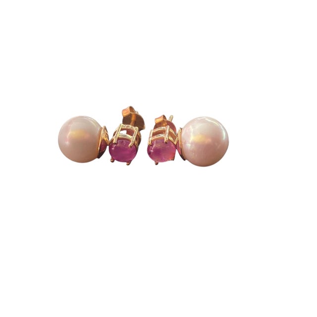 superb and elegant 18k solid gold earring boasts a sophisticated round ;Rubies and a pearl measuring 0.50" H by 0.25" W by...