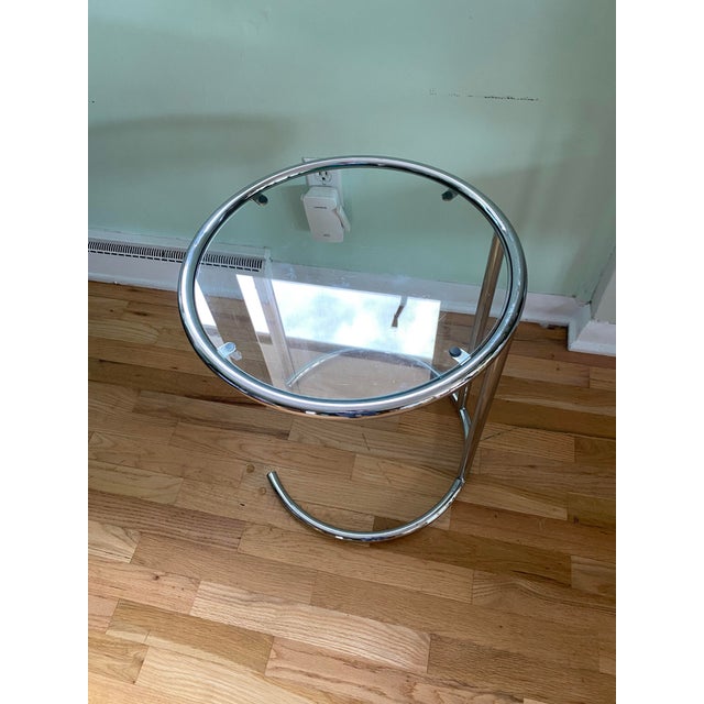 A charming vintage Italian side table from the Space Age era, featuring a sculptural tubular chrome frame with a...