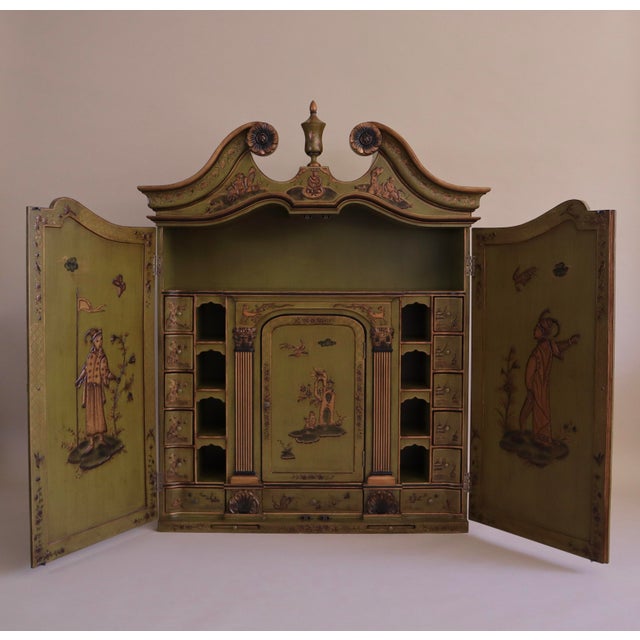 Early 2000s reproduction of 1910s Chinoiserie-style hutch. Eye-catching chartreuse color with raised gold painted details...