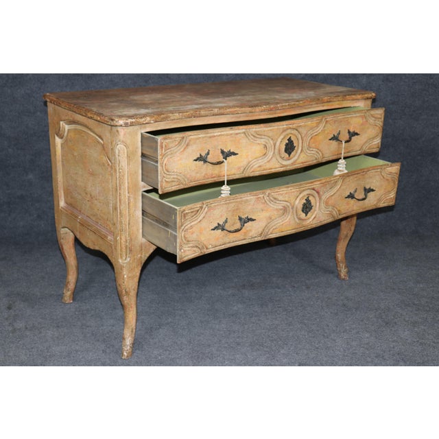 An exceptionally charming and highly decorative Italian Rococo commode inspired by the celebrated designs of the French...