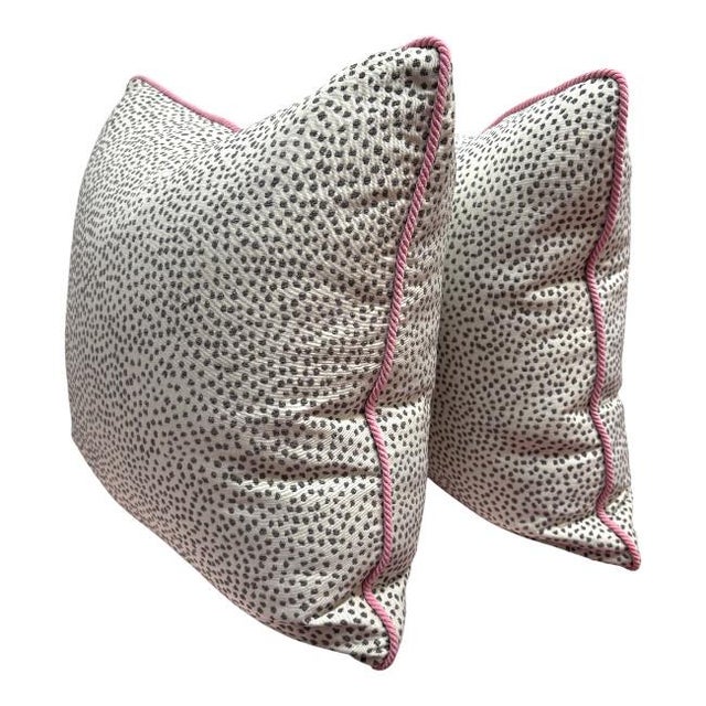 Playful yet polished, this spotted throw pillow adds a touch of modern whimsy to any room. Featuring a black-and-white...