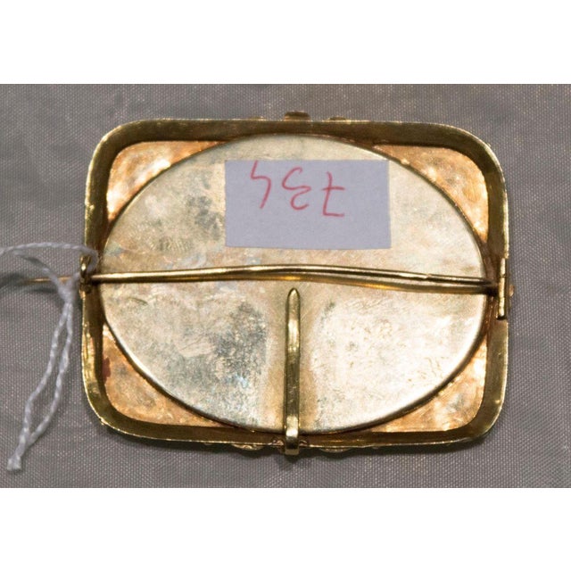 Slate finely decorated with micromosaic. Designed as a pin. Rome, atelier of Giacomo Raffaelli.