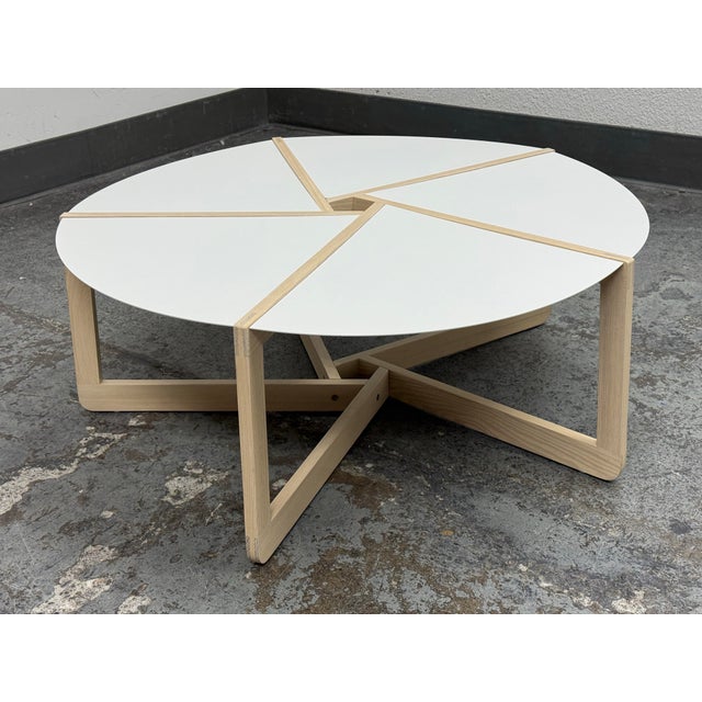 Design Plus Gallery presents the Pi Coffee Table from Blu Dot. This round coffee table has a white powder-coated steel top...