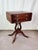 This elegant mid-century Duncan Phyfe Revival drop-leaf table combines classic Federal-style proportions with exceptional...