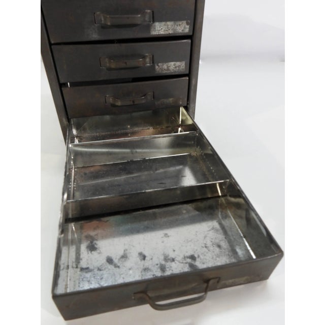 Four drawers open on this midcentury Industrial metal box to accessorize your surroundings. Each drawer has a pull and...