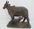 Vintage Indian folk art hand carved wooden statue representing a cow nursing her calf, an iconic depiction of Kamadhenu,...