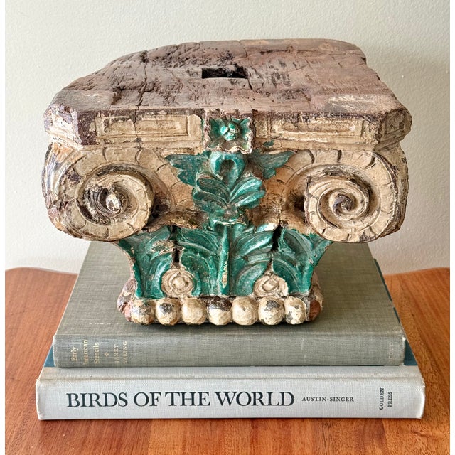 Antique heavy hand-carved wooden Corinthian capital. Visible weathering and wear adds to its aged appeal. An architectural...