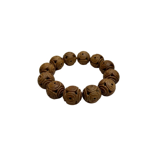 Experience the serene elegance of our Sandalwood Coin Pattern Carving Beads Prayer Rosary Bracelet. This exquisite...