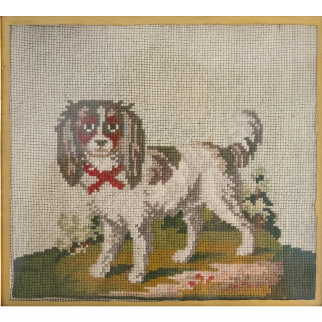 ANTIQUE FOLK ART DOG WOOLWORK Depicting a slightly cheeky and characterful little fellow with a red ribbon tied around his...