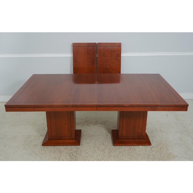 Vintage American-made, solid cherry conference room table or boardroom table with 2 leaves. The double box pedestal is...