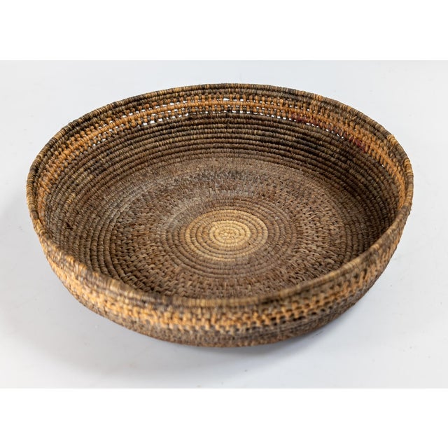 We are selling this nice old Southwest Native American Indian coiled basket. This basket has nice honest age wear and is...