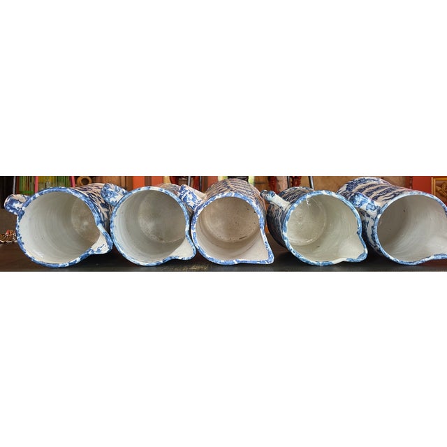 Exceptional set of five English spongeware pitchers from an esteemed California collection. Spongeware is a type of...