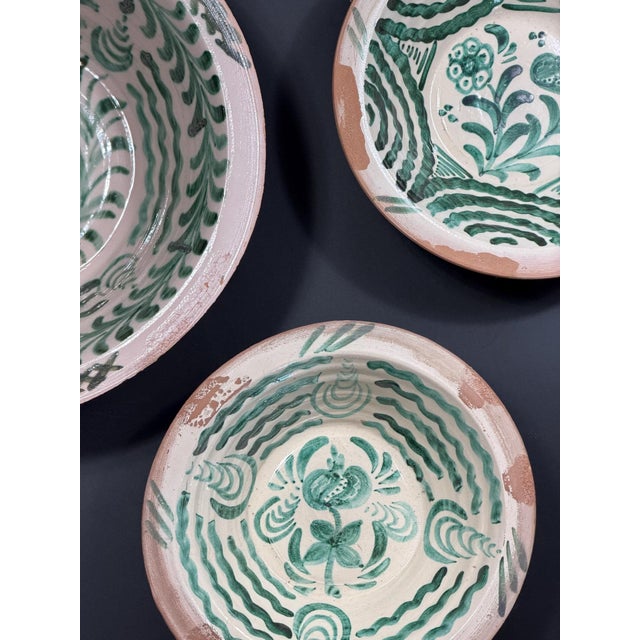 A charming set of three traditional Spanish Fajalauza lebrillos, hand-painted in the characteristic green palette on a...