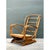 This vintage springer lounge chair is a sculptural study in bent rattan, with a tall, ladder-style back and sweeping,...