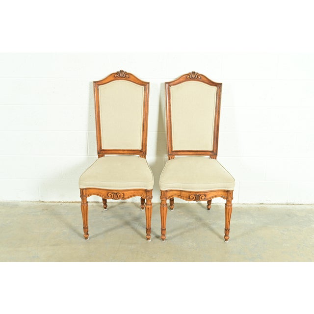 A gorgeous pair of French Regency Louis XVI style side chairs or dining chairs In the manner of Baker Furniture USA, Circa...