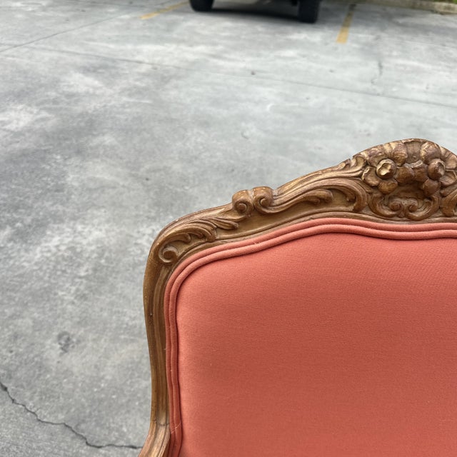 Up for consideration is a beautiful vintage salmon colored cushioned wooden chair. This colorful chair is a great way to...