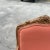 Up for consideration is a beautiful vintage salmon colored cushioned wooden chair. This colorful chair is a great way to...