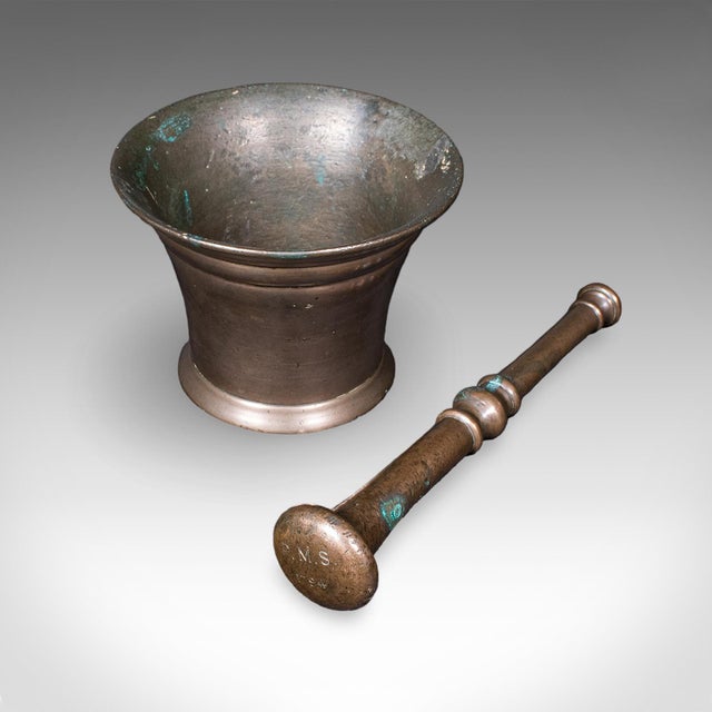This is an antique chemist's counter mortar and pestle. An English, bronze apothecary aid, dating to the Georgian period,...