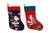 A set of two traditional quilted and embroidered Christmas stockings. Each stocking shows Santa dressed in red. On one he...
