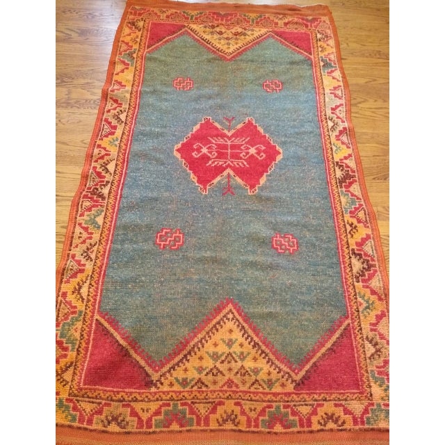 This vintage Moroccan area rug from the third quarter of the 20th century achieves a rare and beautiful balance of...