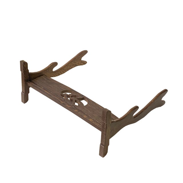 This is an oriental brush pen or sword holder made of wood with nice gray brown pattern color on the surface. It has a...