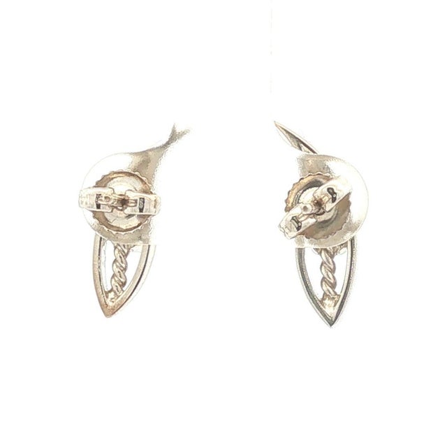 A pair of 14k gold stud earrings featuring round white diamonds. The design is sleek with an openwork leaf pattern. The...