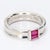This classic Tiffany & Co. design is a timeless ring which also features two ruby baguettes. - Stone Info - 2x Ruby...
