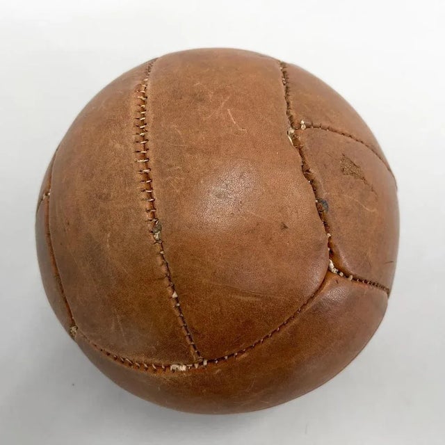 Original vintage heavy leather training ball with beautiful patina. The ball is made of handstitched genuine leather in...
