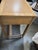Charming vintage French Provincial writing desk and coordinating chair, featuring a warm light wood finish, and elegant...