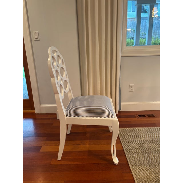 Constructed from pigmented lacquered mahogany wood and performance pinstripe blue upholstery. Finished in eggshell white....