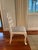 Constructed from pigmented lacquered mahogany wood and performance pinstripe blue upholstery. Finished in eggshell white....