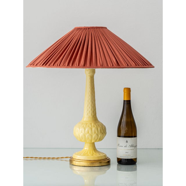 A butter-yellow, high-gloss ceramic lamp of the type collectors call Casa Pupo — after the Pimlico Road shop opened in...