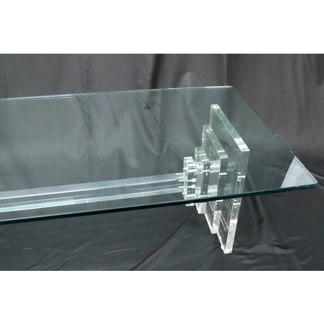 Mid-Century Modern heavy stacked Lucite base glass top coffee table.
