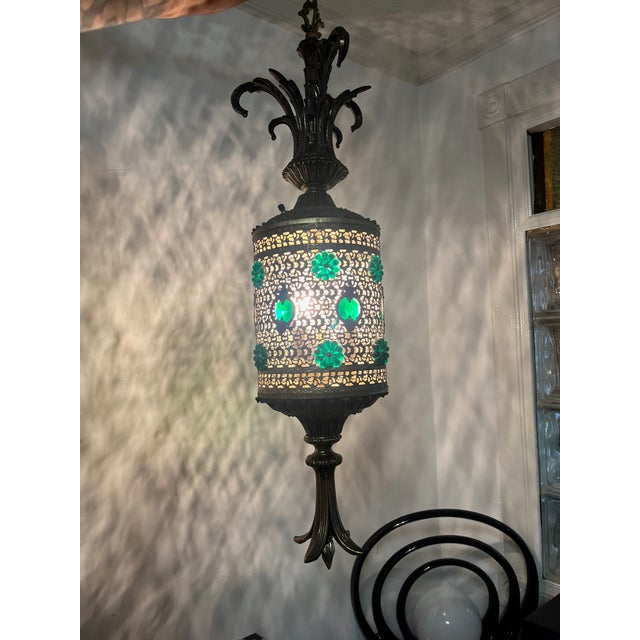 MCM hollywood regency glam hanging lamp Ornate Gold and brass tones with acrylic emerald floral details wrapping around...