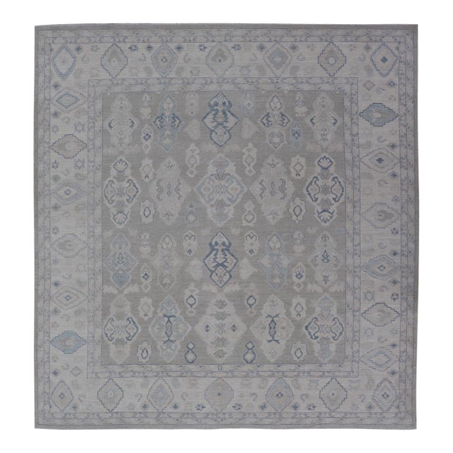 Turkish Oushak Rug With Soft Gray Field and Pale Blue Geometric Motifs For Sale