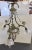 Beautiful Gothic style four light chandelier from the early 1900's. It is made of bronze with frosted glass flower light...