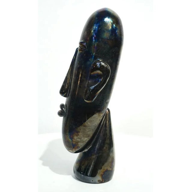 Amazing modern head in an ethnic design inspired by the Easter Island statues, very expressive mouth-blown sculpture in...