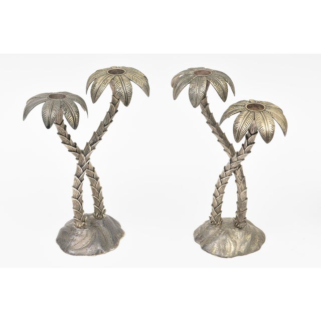 This lovely pair of vintage silver plate palm tree candlesticks are from the 70's and made by Godinger. Coastal meets...