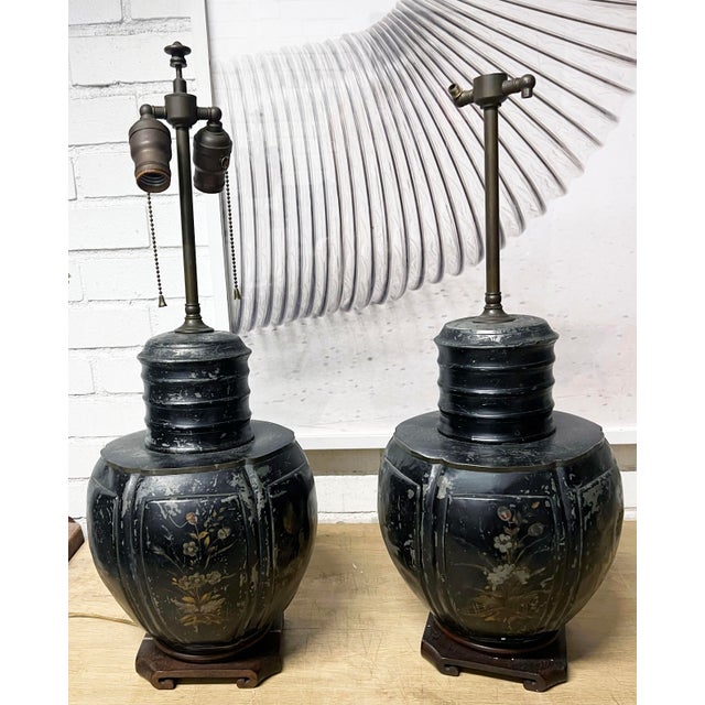 Pair of Chinese Tea Canister Lamps, also known as Chinoiserie toleware or tea caddy lamps, are accent lighting fixtures...