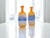 Add a pop of color to your space with this charming pair of 1980s-style decorative bottles. These pieces, with their...