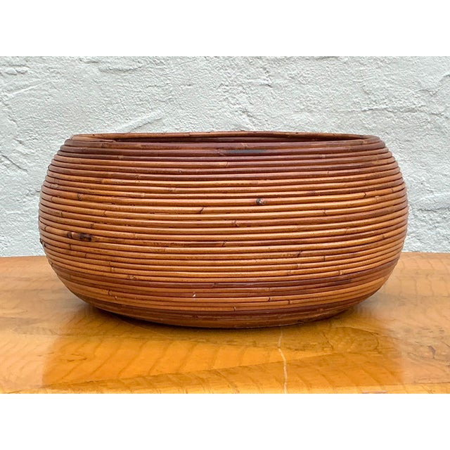 Make a striking statement with this monumental vintage pencil reed basket. Evoking the sophisticated organic modernism of...